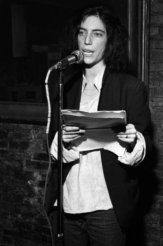 Patti Smith recites poetry on stage at a club called Local in New York City in 1975